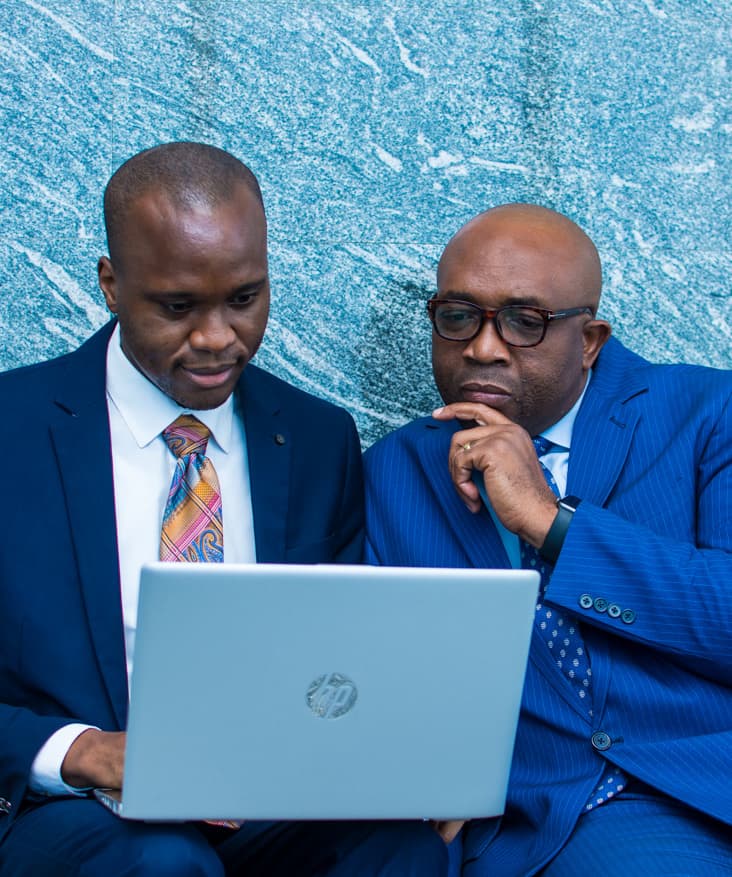 Two Access Bank staff looking at a computer