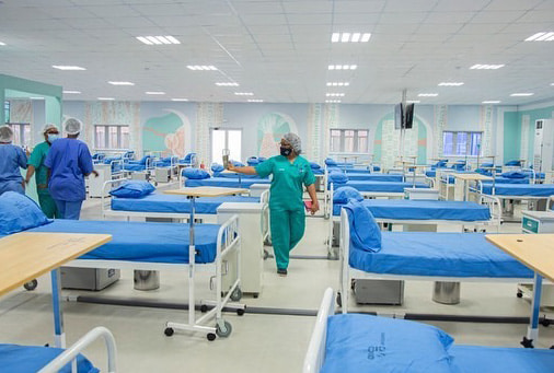 Hospital with empty beds and medical staff