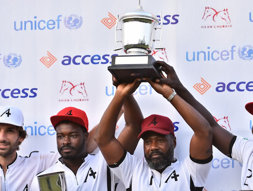 Winners lifting cup at access competition